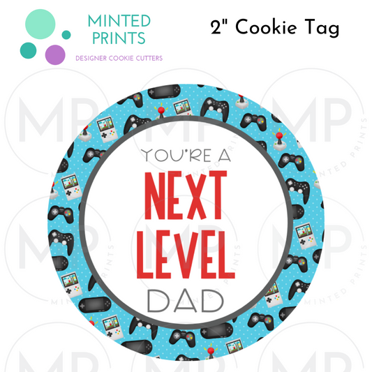 Next Level Dad 2" Cookie Tag with Gaming Consoles Background